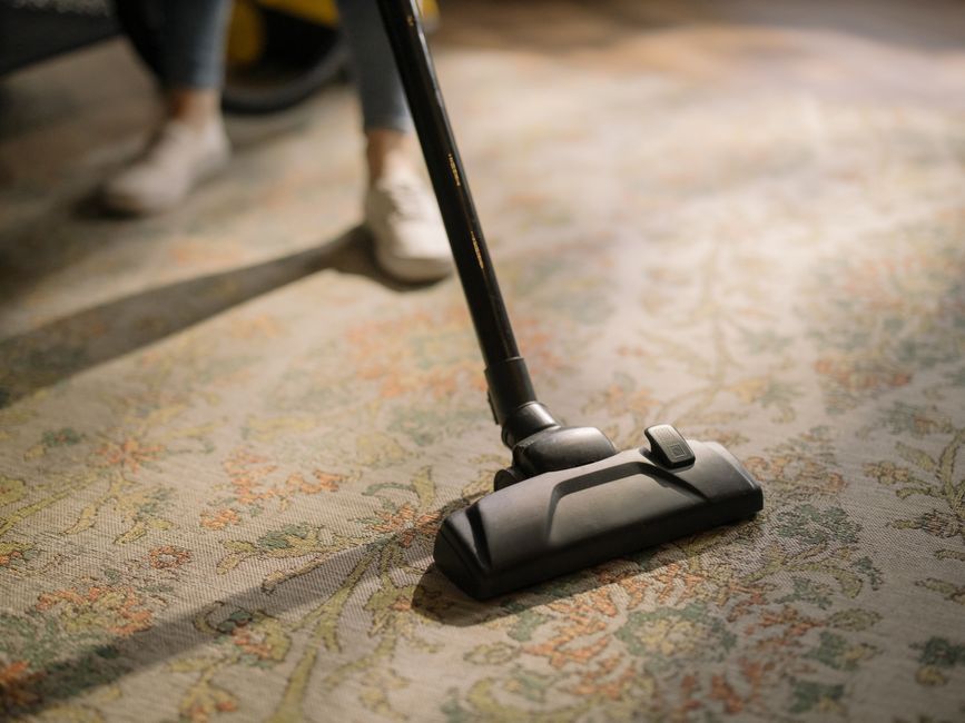 Professional vacuuming carpet floor